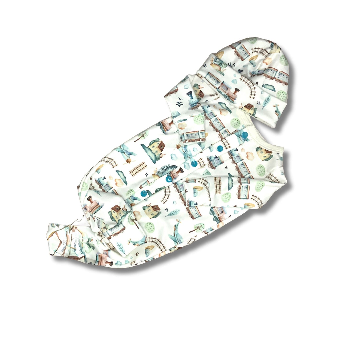 Baby sleeper with front snaps and a matching hat. The print is in planes and trains with houses and train tracks.