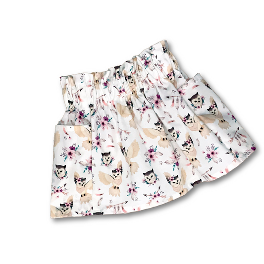 Cute boho print cotton pocket skirt with a paperbag waist. Watercolor owls with pink flowers on a white background