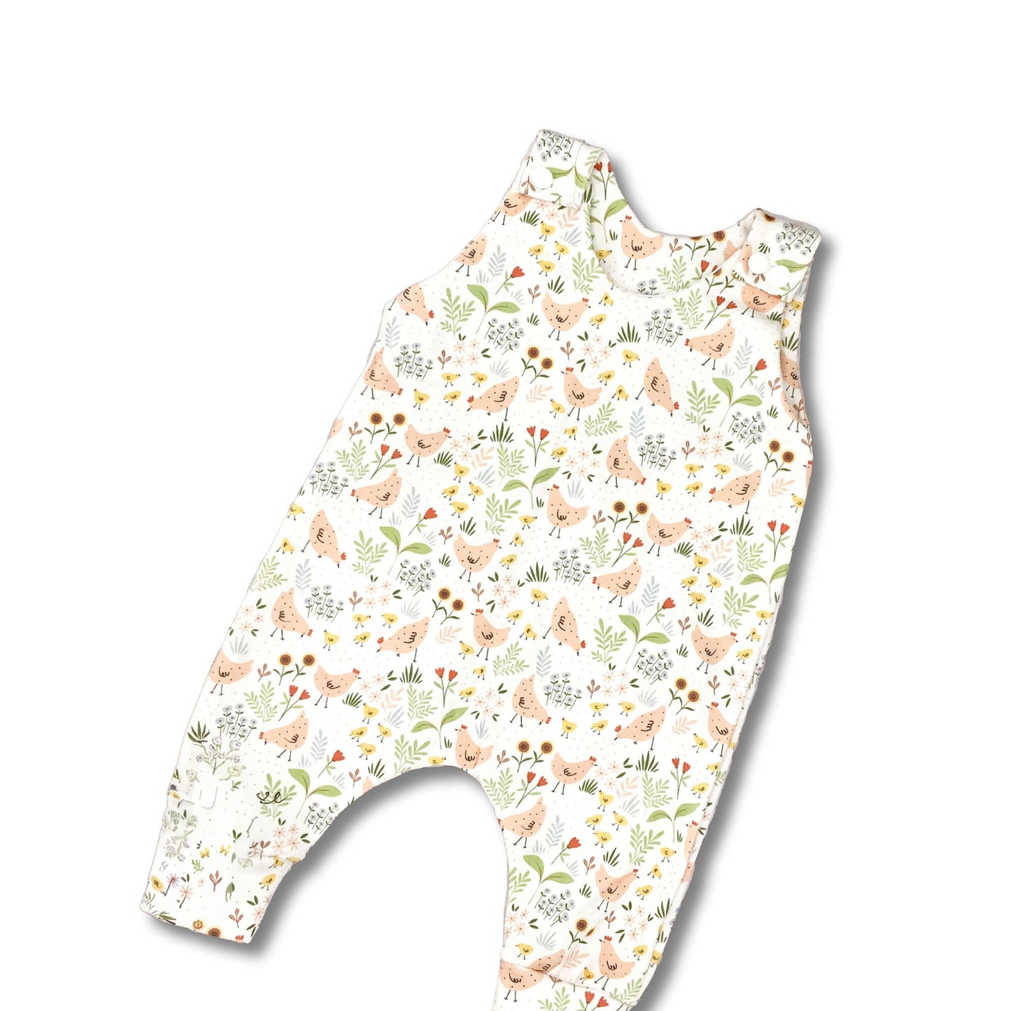 Long romper with shoulder snaps.  Cute retro chicken print with greenery and flowers on a white background