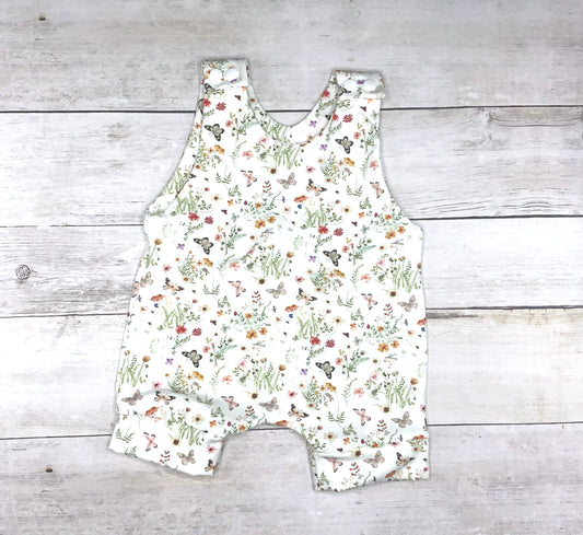 Summer short romper for baby and toddler girls with a flower and butterfly print