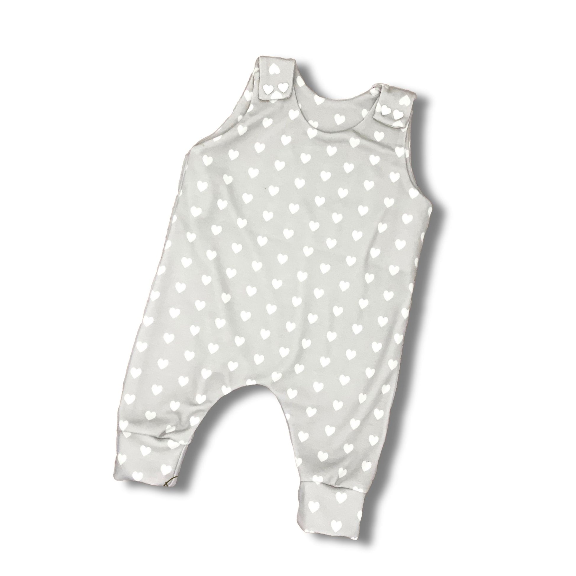 Long romper with white hearts on a light gray background for baby girl