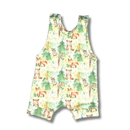 Cute short summer romper with forest wildlife and trees.  The print has bears, foxes, deer and raccoons