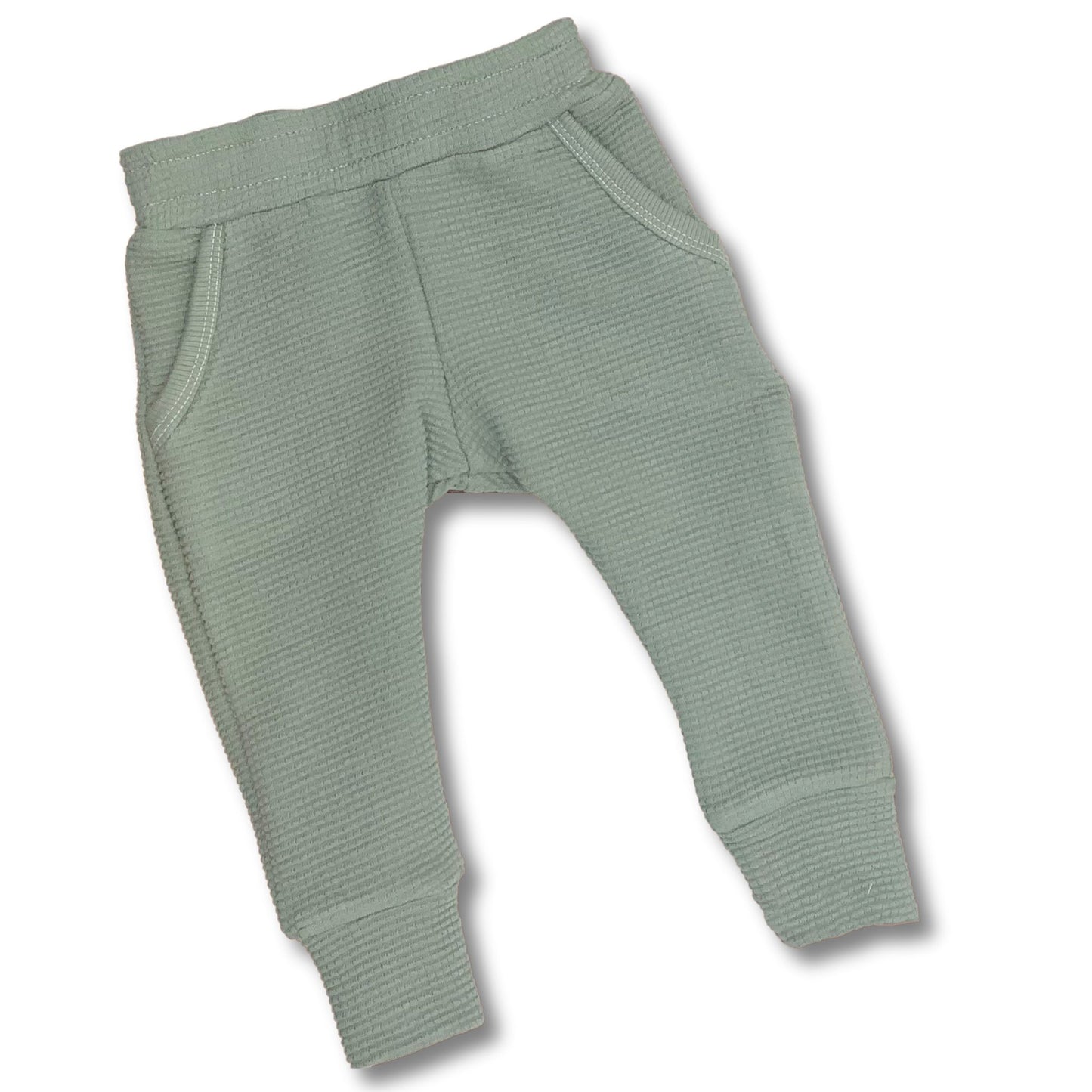 Soft organic cotton waffle joggers for baby and toddler in a pistachio color