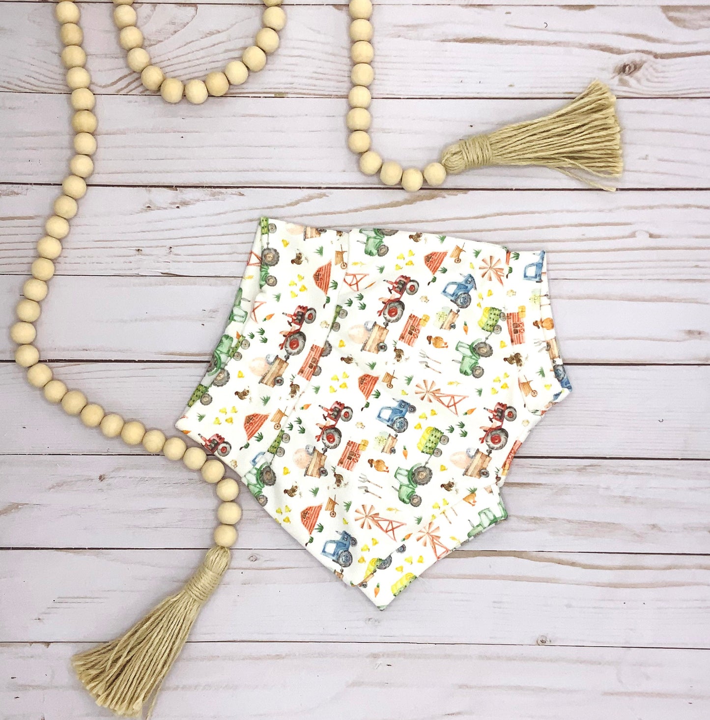 Spring Farm Print Organic cotton bummies shorts for baby and toddler in cute farm print with tractors, wagons, windmills and more farm related items
